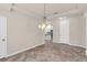Bright dining area with tile flooring and a modern chandelier fixture at 8230 Corkfield Ave, Orlando, FL 32832