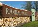 Randal Park community entrance sign set on a stone wall at 8230 Corkfield Ave, Orlando, FL 32832