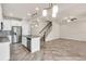 Open kitchen area features stainless steel appliances, a center island, and tile flooring at 8230 Corkfield Ave, Orlando, FL 32832