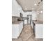 Modern kitchen features stainless steel appliances, white cabinets, and a tile backsplash at 8230 Corkfield Ave, Orlando, FL 32832