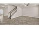 Bright living room features tile flooring, a ceiling fan, and a staircase at 8230 Corkfield Ave, Orlando, FL 32832