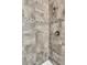 Close up of a glass-enclosed shower featuring stylish tile work, a shower head, and modern fixtures at 8230 Corkfield Ave, Orlando, FL 32832
