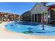 Community splash pad with colorful fountains and covered seating areas at 8230 Corkfield Ave, Orlando, FL 32832