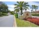 Community entrance sign for Vizcaya surrounded by Palm Trees and flower beds at 8418 Via Bella Notte, Orlando, FL 32836