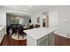 Open kitchen design with an island that looks into the dining and living area, creating an inclusive space at 8418 Via Bella Notte, Orlando, FL 32836