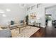 Bright living room with dark floors, modern lighting, and large windows at 8418 Via Bella Notte, Orlando, FL 32836