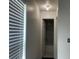 Bathroom featuring a white color scheme, with a window and light fixture at 909 San Paulo Way, Kissimmee, FL 34758