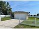 Charming single-story home with an attached two-car garage and front yard at 909 San Paulo Way, Kissimmee, FL 34758