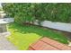 Spacious backyard featuring a lush lawn, mature trees, and a white fence enhancing privacy and visual appeal at 1017 Manchester Cir, Winter Park, FL 32792