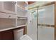 This bathroom features a shower and built in shelving at 1017 Manchester Cir, Winter Park, FL 32792