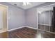 This bedroom features hardwood floors, a mirrored closet, and neutral walls at 1017 Manchester Cir, Winter Park, FL 32792