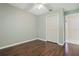 The bedroom features hardwood floors, neutral walls, and a ceiling fan at 1017 Manchester Cir, Winter Park, FL 32792