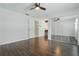 This bedroom has wood floors, a ceiling fan, and a mirrored closet at 1017 Manchester Cir, Winter Park, FL 32792