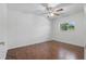 A sun-filled bedroom features wood flooring, a ceiling fan and natural light at 1017 Manchester Cir, Winter Park, FL 32792
