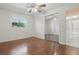 This light-filled bedroom features wood flooring, a ceiling fan and double door closet at 1017 Manchester Cir, Winter Park, FL 32792