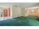 The living room features green carpet, a wooden front door, and neutral walls at 1017 Manchester Cir, Winter Park, FL 32792