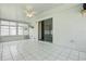 Inviting sunroom with tile floors, ceiling fan, and sliding glass door leading to the backyard at 1017 Manchester Cir, Winter Park, FL 32792