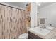 Functional bathroom with a shower, vanity, and built-in shelving at 116 Candlewick Ct, Sanford, FL 32771