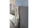 Kitchen with stainless refrigerator and white cabinets at 1212 Leon Ln, Daytona Beach, FL 32117
