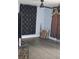 Living room with grey flooring, black and gold curtains and a ceiling fan at 1212 Leon Ln, Daytona Beach, FL 32117