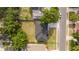 Bird's-eye view of the property showcasing the house, backyard, surrounding trees, and a well-maintained lawn at 1331 19Th St, Orlando, FL 32805