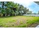 Spacious backyard featuring mature trees and a privacy fence, perfect for outdoor activities at 1331 19Th St, Orlando, FL 32805