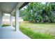 Covered patio overlooking the expansive backyard, ideal for outdoor entertaining and relaxation at 1331 19Th St, Orlando, FL 32805