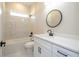A modern bathroom with white marble tiling, quartz countertops and sleek black hardware at 1331 19Th St, Orlando, FL 32805