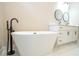 Spa-like bathroom highlighting a modern soaking tub, sleek fixtures, and a tranquil ambiance at 1331 19Th St, Orlando, FL 32805