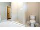 Elegant bathroom featuring a glass shower, modern fixtures, and pristine porcelain toilet at 1331 19Th St, Orlando, FL 32805