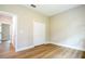 A simple, spacious bedroom with wood floors and a closet at 1331 19Th St, Orlando, FL 32805