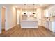 Bright open-concept kitchen with white cabinets, quartz countertops, and stainless steel appliances at 1331 19Th St, Orlando, FL 32805