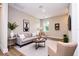 Bright living room with stylish furniture, wood-like flooring, and large windows with natural light at 1331 19Th St, Orlando, FL 32805