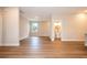Bright open-concept living room boasting vinyl plank flooring and an adjacent powder room for guest convenience at 1331 19Th St, Orlando, FL 32805