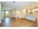 Bright open-concept living space showcasing the kitchen, and doorway to the bathroom and bedroom at 1331 19Th St, Orlando, FL 32805