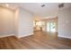 Expansive open living area featuring wood-like floors, abundant natural light, and seamless access to the kitchen at 1331 19Th St, Orlando, FL 32805