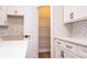 Charming pantry with plentiful shelving, quartz countertops, subway tile backsplash, and sleek black hardware at 1331 19Th St, Orlando, FL 32805