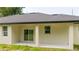 Covered patio with sliding glass doors offering seamless indoor-outdoor living and entertainment at 1331 19Th St, Orlando, FL 32805