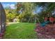 Backyard with large lawn and playset area at 1343 Charlotte St, Altamonte Springs, FL 32701