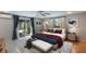 Cozy bedroom with a plush bed, neutral walls, and large windows offering lots of natural light at 1343 Charlotte St, Altamonte Springs, FL 32701