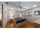 Bedroom with natural light and hardwood floors, complemented by neutral wall paint and a ceiling fan at 1343 Charlotte St, Altamonte Springs, FL 32701