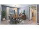 Modern dining room with a wooden table set for four, a buffet, stylish light fixture and tiled floors at 1343 Charlotte St, Altamonte Springs, FL 32701