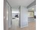 Hallway that leads to a beautifully designed living area, featuring tile floors, a map, and an inviting atmosphere at 1343 Charlotte St, Altamonte Springs, FL 32701