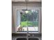 Kitchen window offers a view of the screened-in porch, seamlessly connecting indoor and outdoor living at 1343 Charlotte St, Altamonte Springs, FL 32701