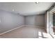 Bright living room featuring neutral tile flooring, recessed lighting, and access to a screened-in patio at 1343 Charlotte St, Altamonte Springs, FL 32701