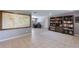 Versatile open living space with a bookshelf, office area, tile floors, and ample natural light at 1343 Charlotte St, Altamonte Springs, FL 32701