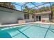 Screened in pool with travertine decking, adjacent to outdoor storage with easy access to the home's interior at 1343 Charlotte St, Altamonte Springs, FL 32701
