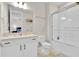 Bathroom featuring a shower-tub combo with white tile surround and a white vanity at 1425 Lone Wood Blvd, Orlando, FL 32828