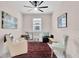 Comfortable, stylish bedroom with a ceiling fan, neutral paint, a window and furniture on an area rug at 1425 Lone Wood Blvd, Orlando, FL 32828