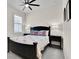 Comfortable bedroom with carpet, ceiling fan, and a view to the exterior at 1425 Lone Wood Blvd, Orlando, FL 32828